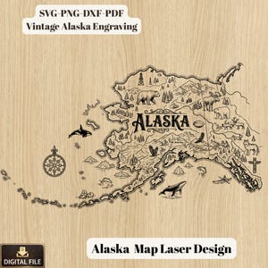 May include: A detailed laser-cut map of Alaska, with illustrations of wildlife, mountains, and a compass rose. The map includes the text "Alaska" and is labeled "Alaska Map Laser Design" and "Vintage Alaska Engraving".