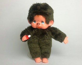 Peluche tétine vintage singe Monchhichi Sekiguchi, fourrure brune, yeux bleus, grandes oreilles, jouet de collection, cadeau souvenir du Japon des années 70.