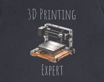 Può includere: Una maglietta blu scuro con una grafica bianca che mostra una stampante 3D e il testo "3D PRINTING EXPERT".