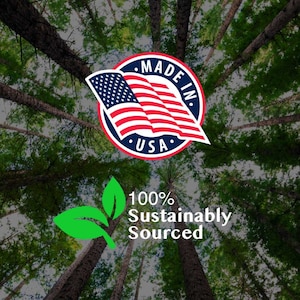 May include: A red, white, and blue American flag with the words "Made in USA" in a circle around it. The flag is against a backdrop of green trees. Below the flag is a green leaf with the text "100% Sustainably Sourced".