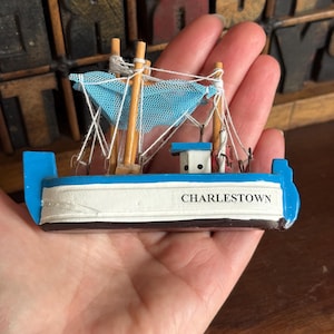 Small vintage wooden fishing boat, ship. Nautical decor