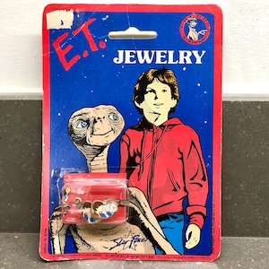 Bijoux E.T vintage des années 1980. Boucles d&#39;oreilles E.T et Elliot sous blister d&#39;origine