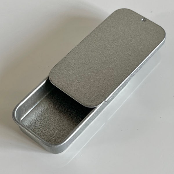 Small rectangular aluminium tin with sliding lid. 51 x 26 x 9mm