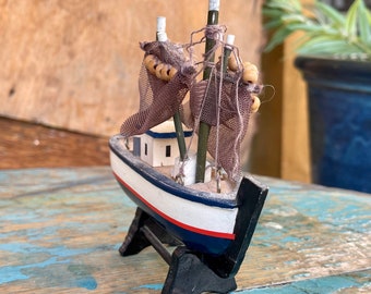 Vintage miniature wooden model fishing boat