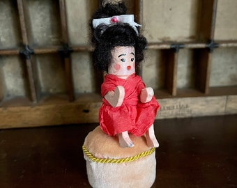 Tiny vintage wooden doll and miniature pouffe