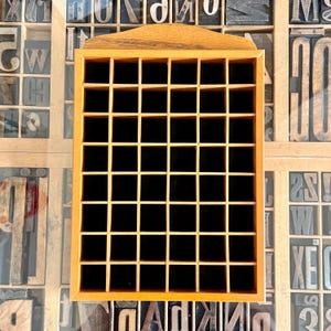 Vintage thimble display case with 48 compartments