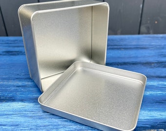 Lata cuadrada apta para alimentos con tapa deslizante, escalonada para apilar. 127x52mm