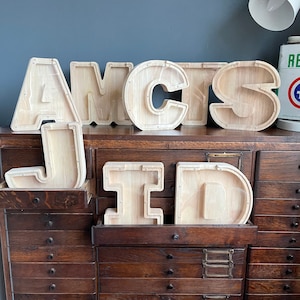 Wooden letter money bank