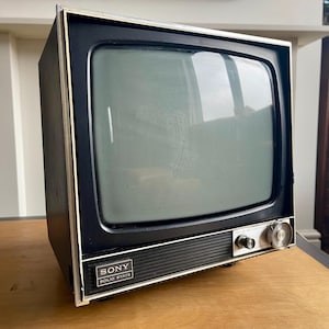 Vintage Sony solid state portable television. Spares or repairs