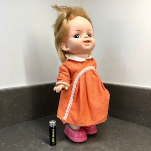 Vintage tinplate and plastic Japanese clockwork toy doll. Walks!