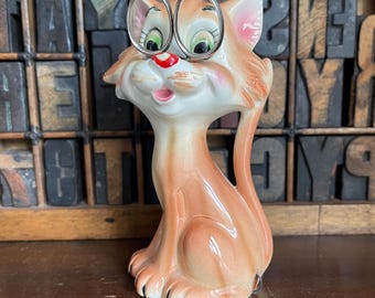 Vintage kitsch novelty tape measure and scissors combo. Pink cat figurine
