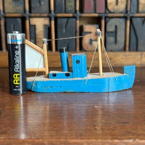 Small vintage wooden fishing boat, ship. Nautical decor