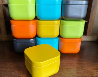 Colourful storage tins for candles, cosmetics, gifts. Yellow, turquoise, green, orange and anthracite