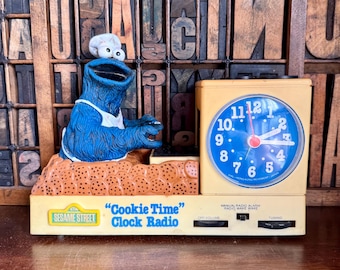 Vintage 1977 Sesame Street Cookie Monster clock radio.