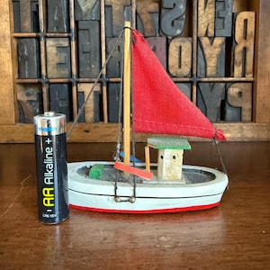 Miniature vintage wooden model sailing boat, ornament. Nautical decor