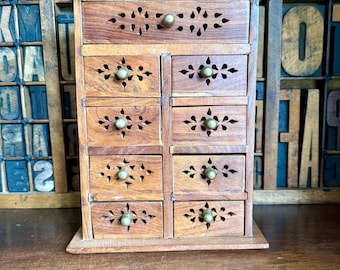 Small vintage hardwood spice cabinet with 9 drawers