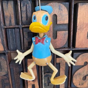 Vintage Disney Donald Duck pull-string hanging puppet toy