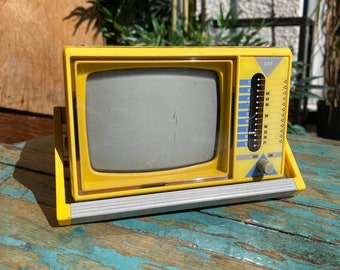 Vintage Boots yellow portable TV. Model MTV-5, 5” screen