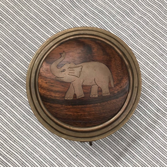 Circular brass and wood with elephant inlay lidded
