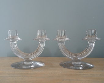 Matching pair of glass Fostoria double candlestick holders