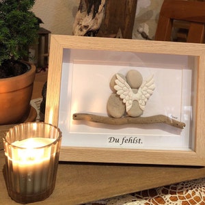 We miss you! A thoughtful stone picture to commemorate a loved one who has passed away - available in various frame sizes and colors.