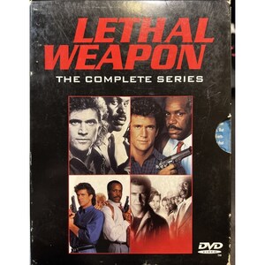 May include: DVD box set of the Lethal Weapon movie series. The box features a collage of images of the main actors, Mel Gibson and Danny Glover, holding guns. The text "Lethal Weapon The Complete Series" is printed on the box.