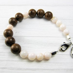 shell, wood | coastal bracelet with silver puka charm | everyday stackable bracelet
