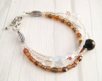 3-strand bracelet/ brown, clear/ tiger eye, crystal, glass/ adjustable