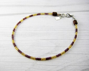 ankle bracelet/ purple, gold, bronze/ glass and hematite beads/ lobster clasp