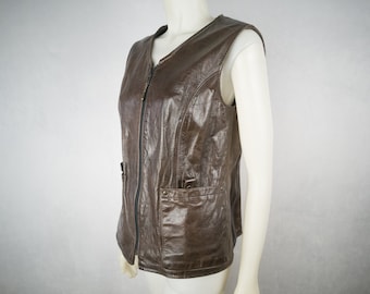 Vintage leather vest, women's 1970s. Size medium, with pockets and belt loops