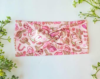 Cowgirl Twist-hårband: Rosa västerländskt kaktusmönster