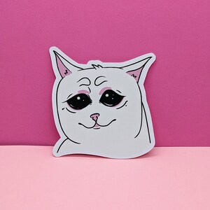 Pegatina de gato blanco triste con diseño felino lindo para computadoras portátiles Más