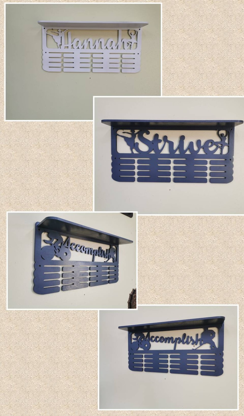 May include: Four medal display shelves with a ballerina silhouette. The shelves are painted in white and dark blue. The shelves are labeled "Hannah", "Strive", "Accomplish", and "Accomplish".