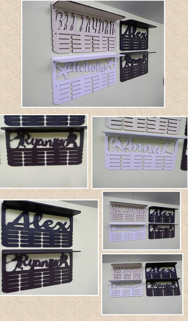 May include: A set of six personalized medal display racks. The racks are made of wood and have a shelf on top. The names "Braydon", "Alex", "Nicholas", "Ryan", "Anna", and "Alex" are displayed on the racks. The racks are painted in various colors, including white, beige, and black.