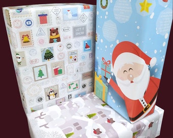eVincE 3 conçoit 30 papiers cadeaux | Enveloppements remplis de faits de Noël | 70 x 50 cm sans pli | Père Noël - timbres de Noël blancs - paysage urbain