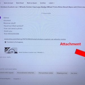 May include: A screenshot of an Etsy listing for custom metal car stickers. The listing shows a preview of the stickers, which feature a logo and the text "Your Logo". The listing also includes a description of the stickers, which are available in a variety of sizes and colors. The listing is in English and includes a button to translate the listing to Portuguese.