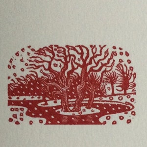 May include: Red woodcut print of a pond with three trees and a scattering of red dots around the edges.
