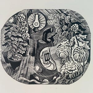 May include: Black and white woodcut print of a still life featuring a lamp, a vase, and various plants. The print is in a circular frame and has a textured, woodblock style.