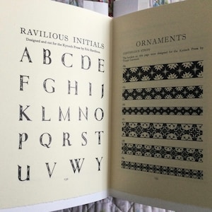 May include: A black and white alphabet with uppercase letters designed by Eric Ravilious for the Kynoch Press. The image also shows black and white continuous strips with repeating patterns.