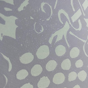 May include: Abstract design featuring a cluster of light green circles resembling grapes, with light green leaf and vine shapes on a gray background. The image has a textured, painted appearance, suggesting an artistic or handmade origin.