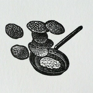 May include: A black and white illustration of a frying pan with a stack of pancakes inside. There are also several pancakes scattered around the pan.
