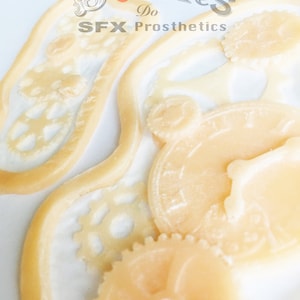 2 Unpainted Silicone Prosthetic, cogs / steampunk