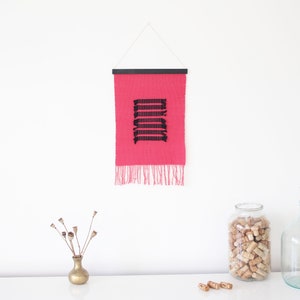 Small Handwoven Wall Hanging in bright pink and black