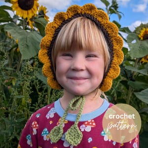 May include: A sunflower-shaped crochet bonnet featuring a dark brown center and bright yellow scalloped petals around the edge. The bonnet includes two green crocheted leaf-shaped ties hanging from the chin area. The text crochet pattern is visible.