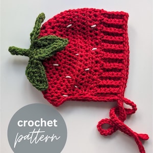 May include: A red crocheted strawberry hat with green leaves and white seed details. The hat has a ribbed edge and ties. The image includes the text "crochet pattern" in a gray circle.