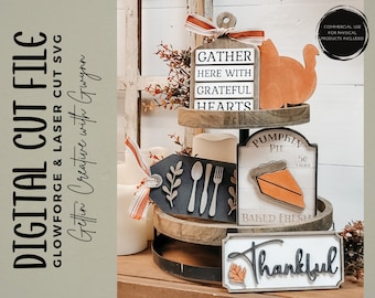 May include: A tiered wooden tray with three signs. The top sign says "Gather Here With Grateful Hearts". The middle sign says "Pumpkin Pie 50c a slice Baked Fresh". The bottom sign says "Thankful".