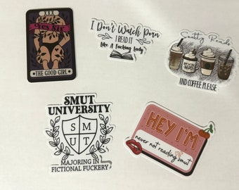 May include: A collection of stickers with various designs and text. One sticker features a tarot card design with the text "Yes Sir" and "The Good Girl." Other stickers include phrases like "I Don't Watch Porn I Read It Like A Fucking Lady," and "Smutty Reads and Coffee Please."