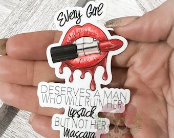 May include: A white sticker with black text that reads "Every Girl Deserves A Man Who Will Ruin Her Lipstick But Not Her Mascara". The sticker features a cartoon image of red lips with a black lipstick tube.