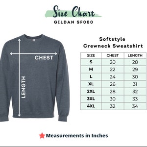May include: A dark gray Softstyle crewneck sweatshirt with a size chart. The chart shows chest and length measurements in inches for sizes S to 4XL. The chest measurements range from 20 to 32 inches, and the length measurements range from 28 to 34 inches.