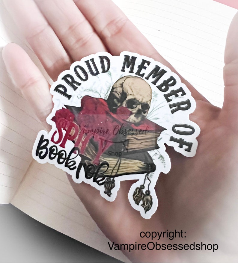 May include: A sticker with a skull and books, and the text "Proud Member of BookTok" and "Vampire Obsessed Shop".